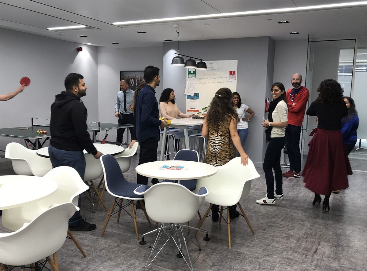Health Financial An image of employees engaging with each other in a shared space