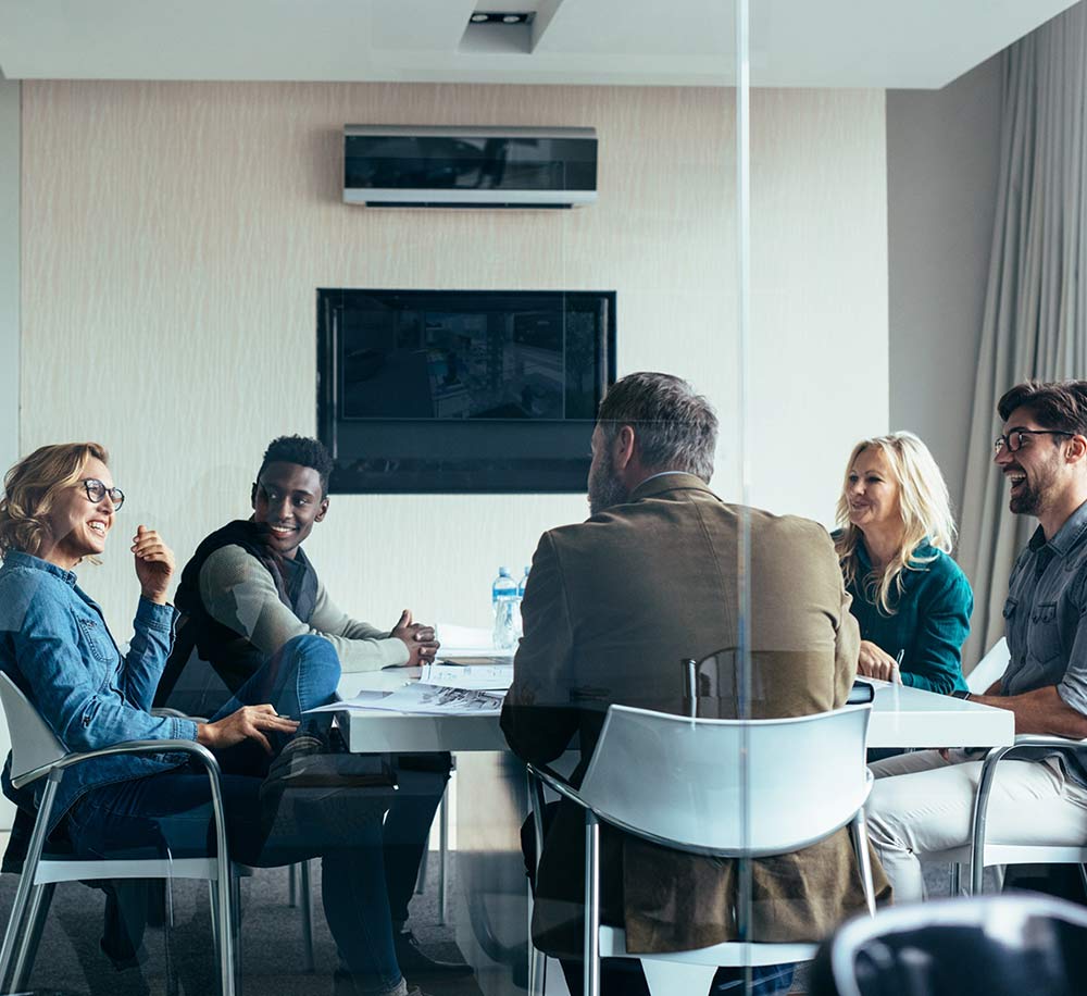 people sitting round an office table