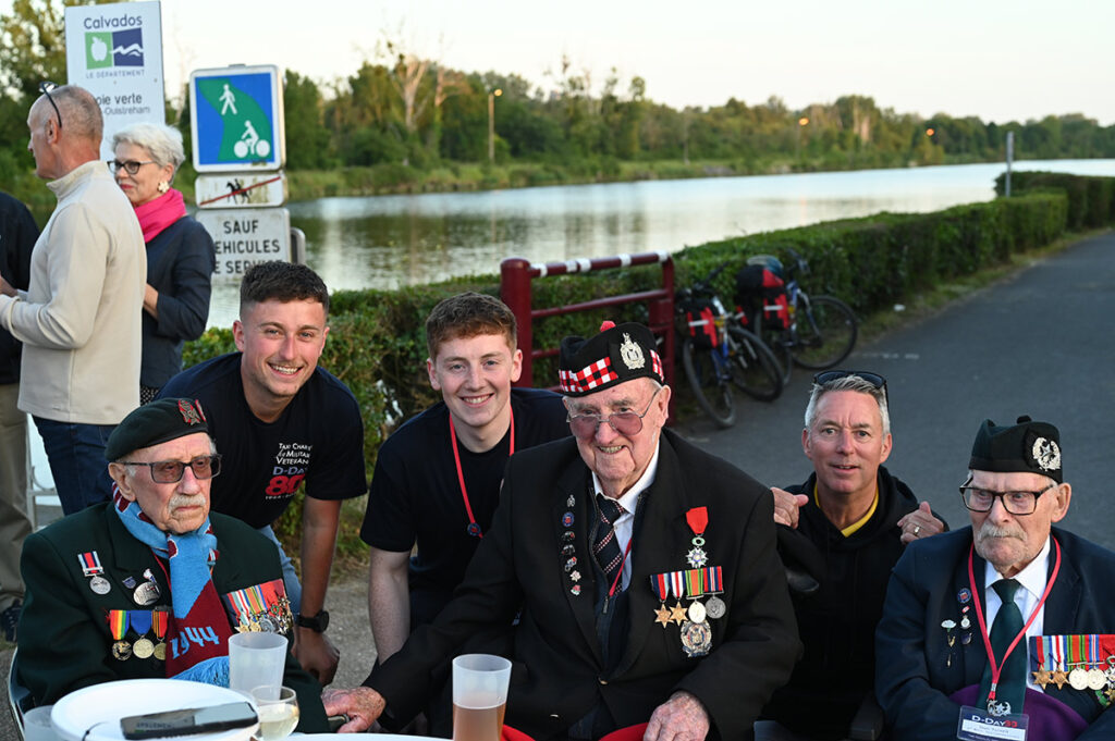D-Day veterans sharing a beer beneath the setting sun