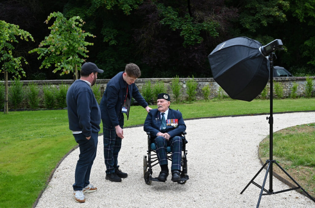 Robin Savage with Donald Turrell outside beside a large photographers lamp